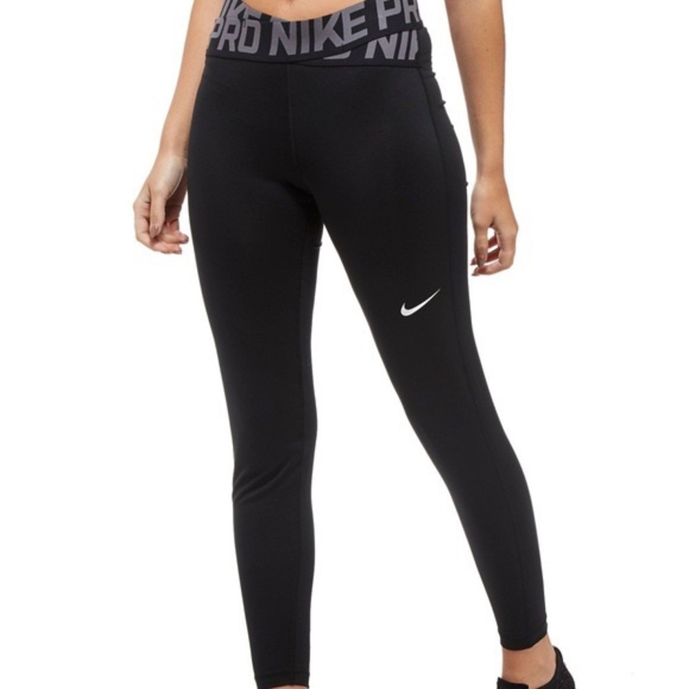 Nike pro leggings with crisscross waist band. Size L, in good condition.